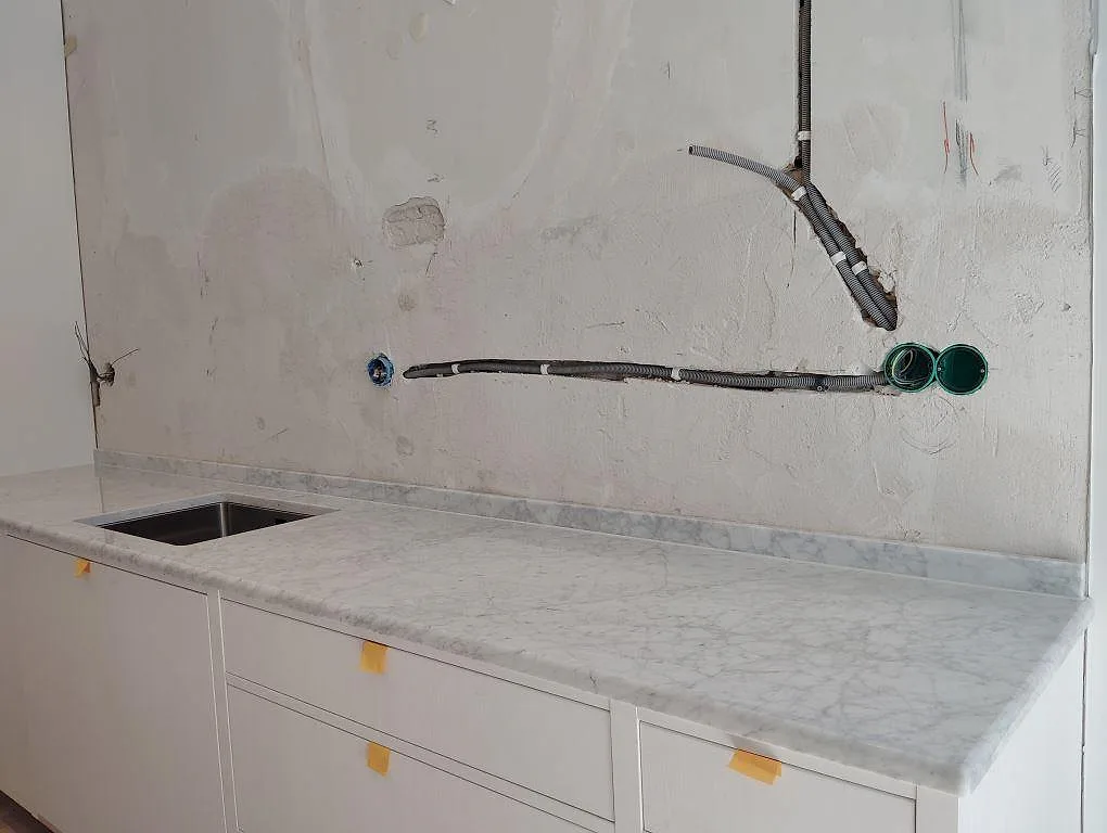 Gennemført projekt: Køkkenbordplade i Carrara C, Stockholm.