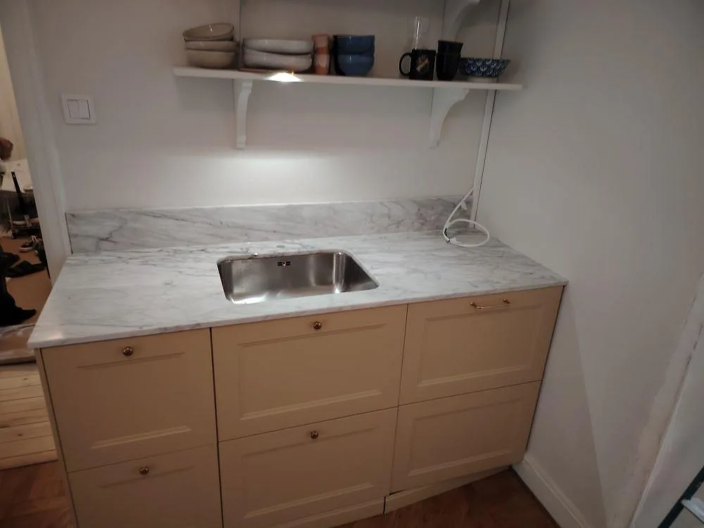 Gennemført projekt: Køkkenbordplade i Carrara C, Stockholm.
