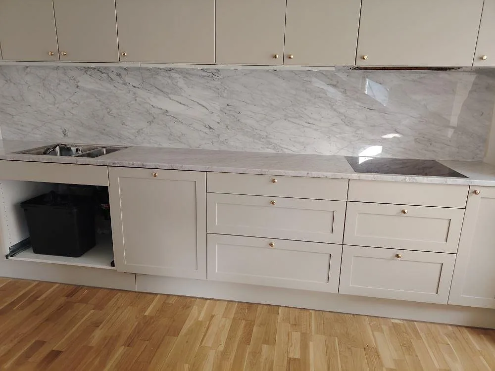 Gennemført projekt: Køkkenbordplade i Carrara C, Stockholm.