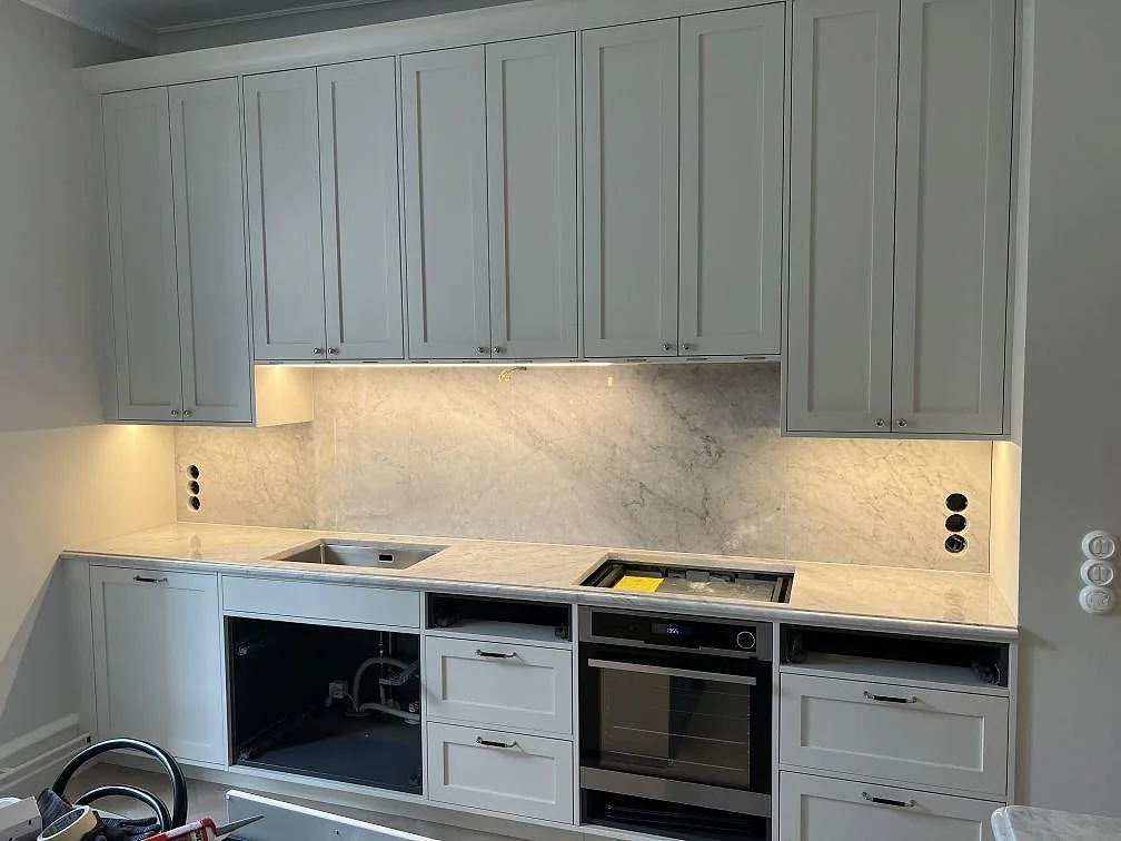 Gennemført projekt: Køkkenbordplade i Carrara C, Stockholm.