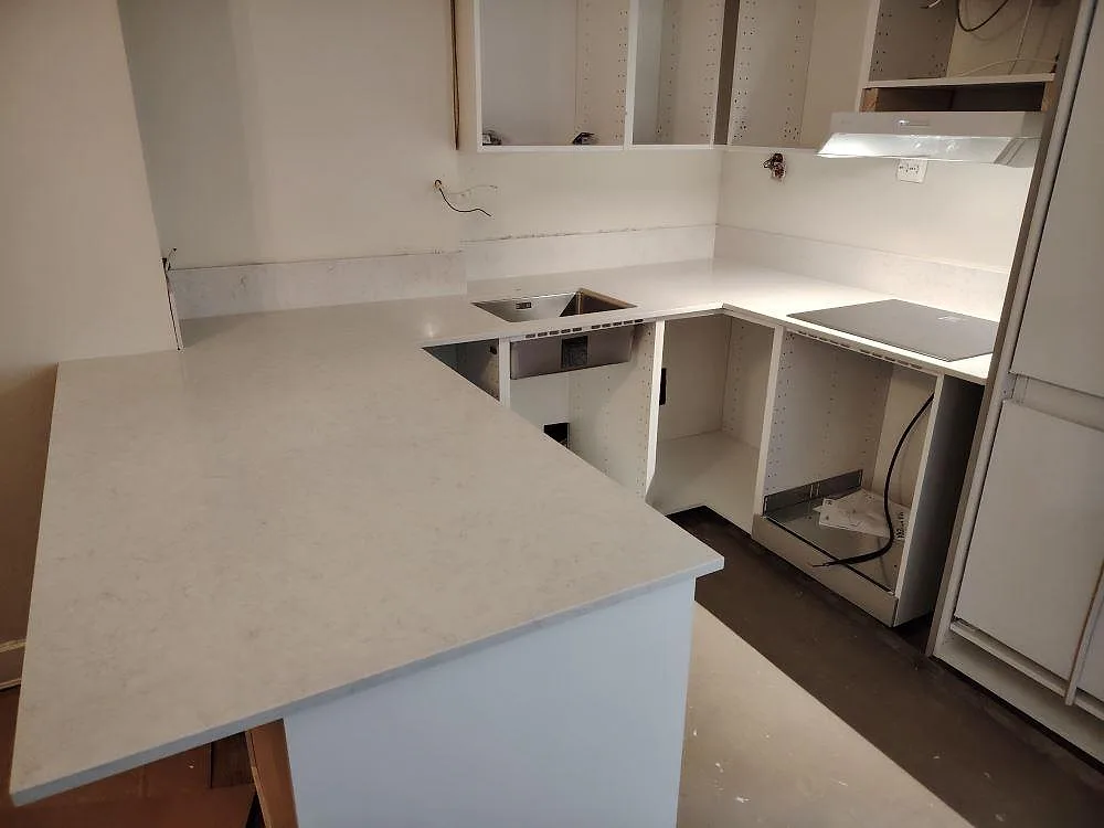 Gennemført projekt: Køkkenbordplade i Silestone Snowy Ibiza, Stockholm.
