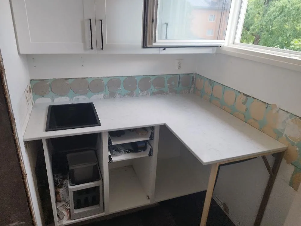Gennemført projekt: Køkkenbordplade i Technistone Noble Carrara, Nacka.